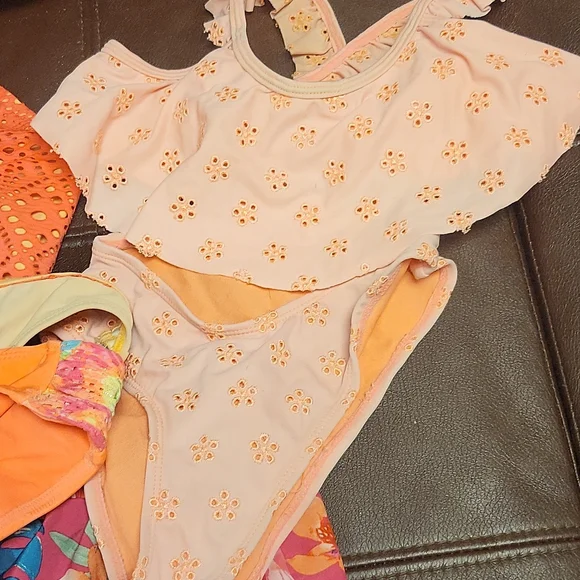 Three bikinis size 6-7 with suze 8 shorts